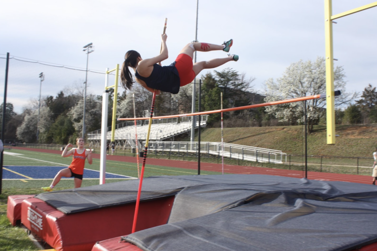 Launching+herself+with+just+a+pole%2C+sophomore+Sydney+Eom+maneuvers+her+body+up+and+over+the+6-foot-high+bar.+After+being+introduced+to+pole+vaulting+by+a+senior+last+year%2C+Eom+now+regularly+competes+in+the+event.+%E2%80%9CIts+definitely+a+bit+scary+at+first%2C+but+I+%E2%80%8B%E2%80%8Bfound+out+it+was+really+fun%2C%E2%80%9D+Eom+said.+